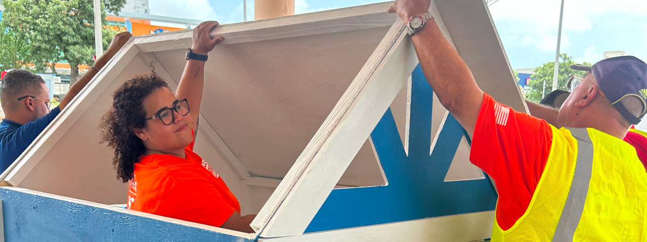 Volunteers building a Playhouse.