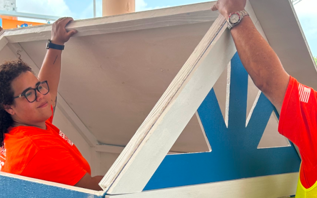 Volunteers building a Playhouse.